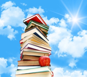 bigstock-Pile-of-books-and-apple-agains-14091116